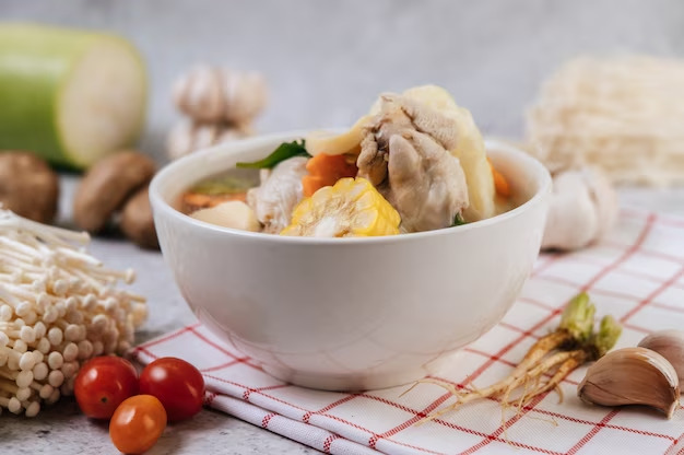 Soup in bowl and spices around