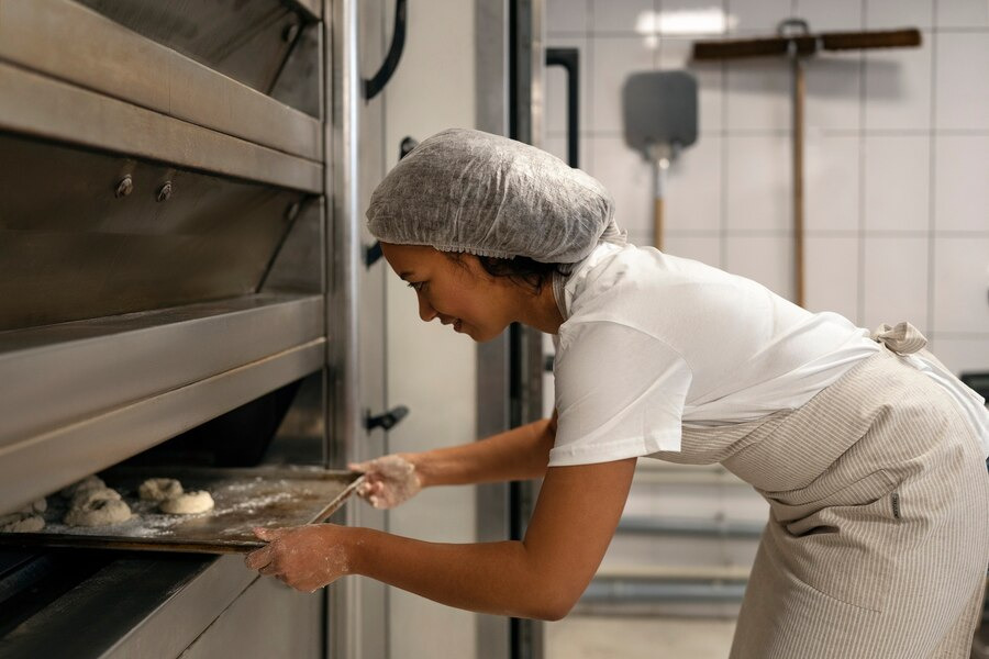putting dough in oven